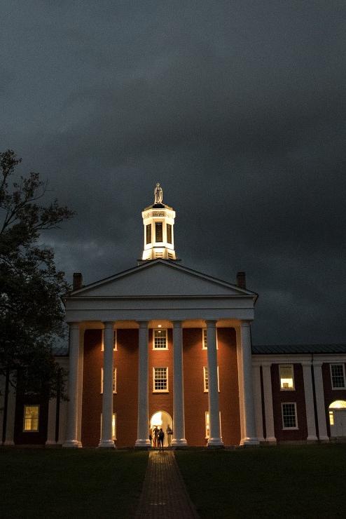 Photo of Washington Hall lit up at night