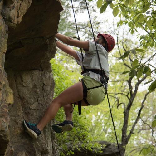 An individual outdoor rock climbing